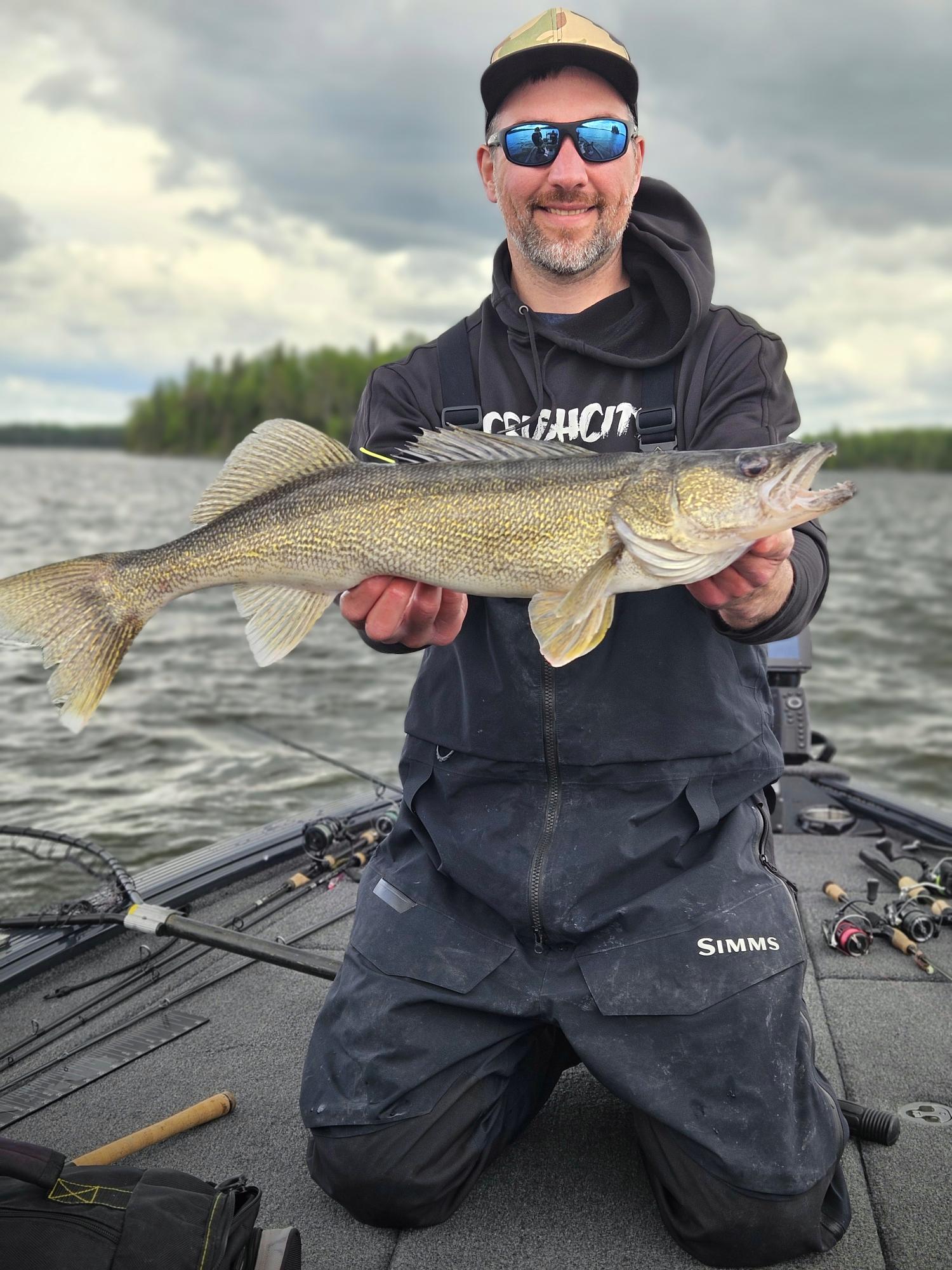 Angler holding a walleye