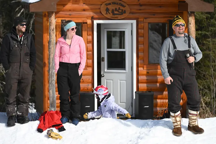 People standing outside the chalet at Dryden Ski Hill